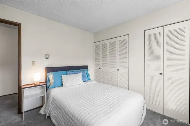 Primary bedroom with dual closets connected through the center.