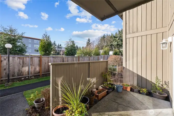 Private fenced patio along the backside of the building.