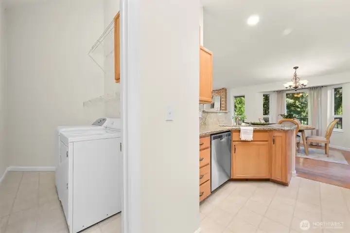 Designated laundry room with loads of storage.