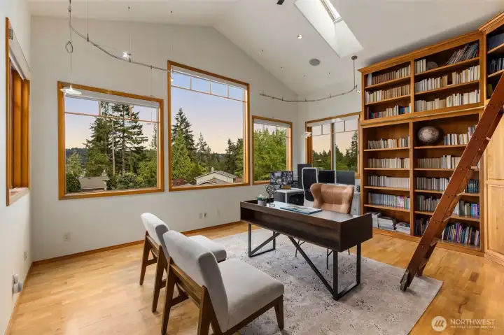 Highly understated in this photo, this office is massive, could fit several desks if you wanted. Skylights and tall windows pour light into this room daily...talk about a great Work From Home setup!!