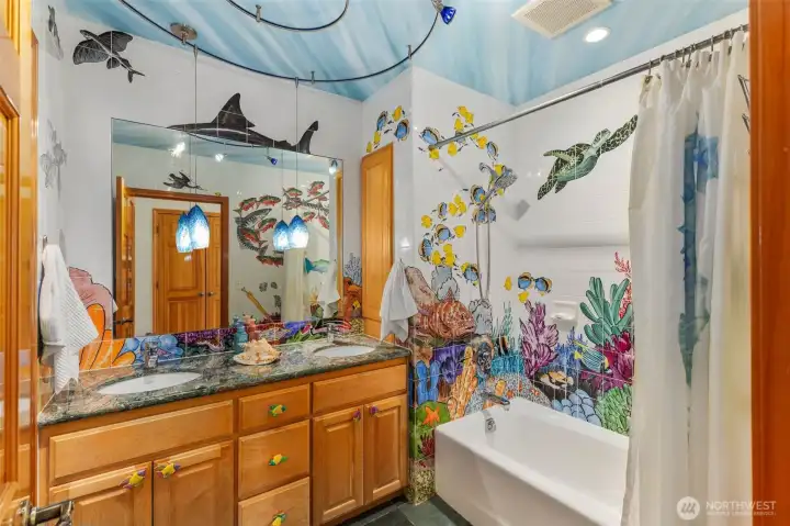 Under the Sea. This nautical inspired bathroom is one of a kind. The original owners hired a professional painter to hand paint part of this nice-sized bathroom.