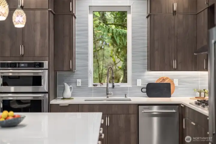 Slab stone counters, stainless appliances and a generous island.