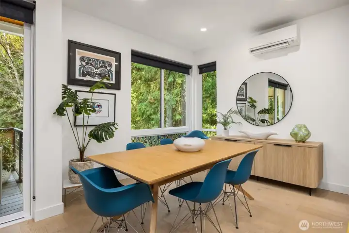 Dining area adjacent to large outdoor deck.
