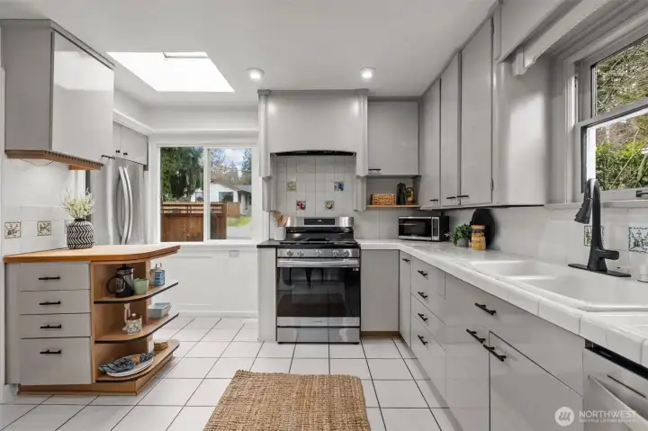 Spacious kitchen with stainless steel appliances.