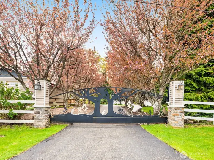 Located on a private, dead end street featuring a gated, tree lined driveway.