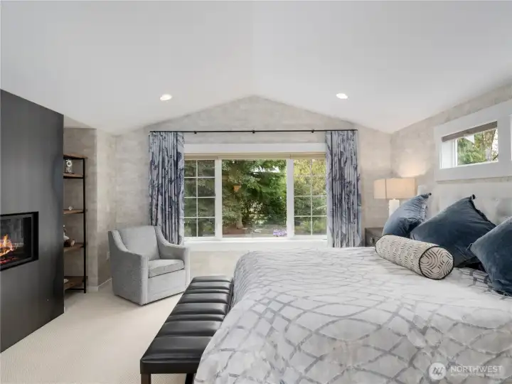 The primary wing features custom designer decor, a dedicated split AC unit for comfort, and a built-in gas fireplace, creating a stylish and cozy retreat. Ideal for relaxation and luxury living.