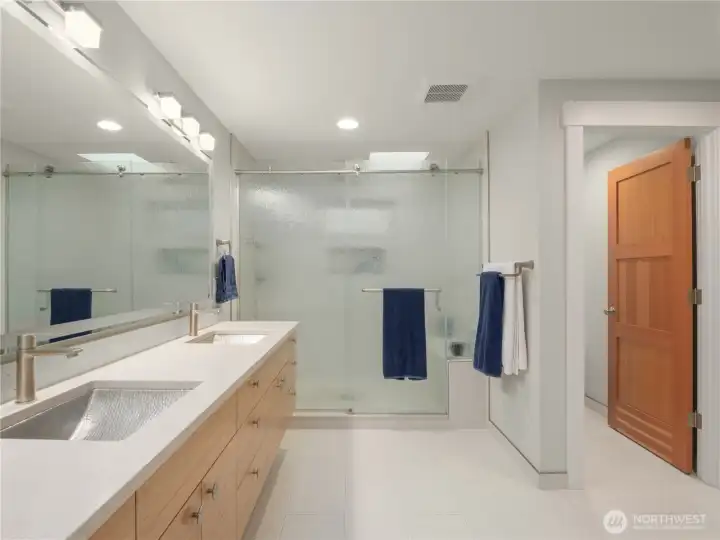 Heated bathroom floors provide cozy warmth, while triple shower heads deliver a luxurious shower experience.