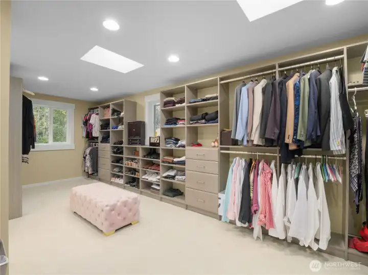 Enjoy custom built-ins for optimal organization and a built-in safe for secure storage. This elegant design combines functionality and style, perfect for any wardrobe.
