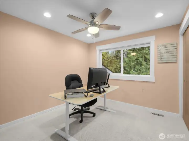 The third bedroom includes a ceiling fan for added comfort, creating a cozy atmosphere for relaxation or sleep.