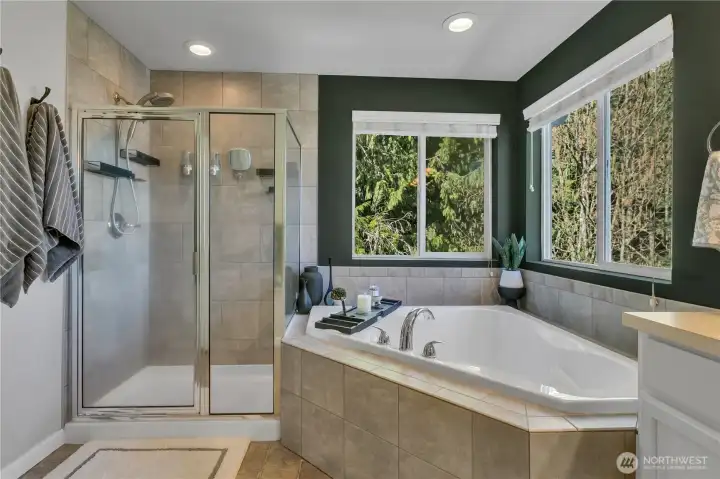 Soaking tub overlooks lush greenbelt creating a private ambiance