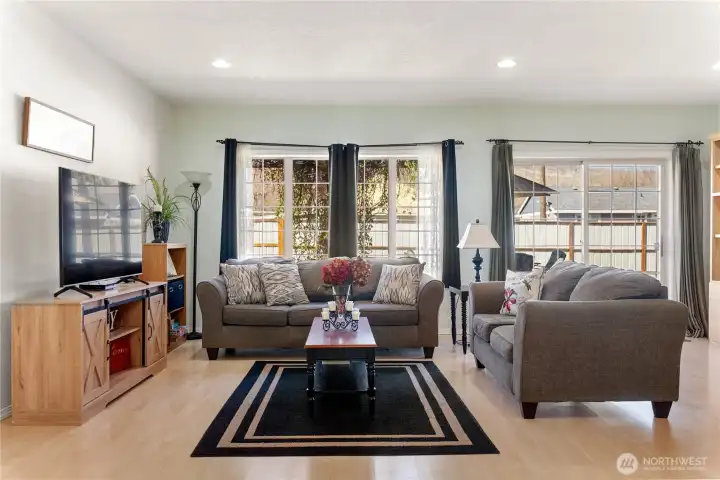 Living room with fenced back yard in the background