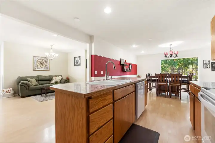 Kitchen, facing dining area and sitting area