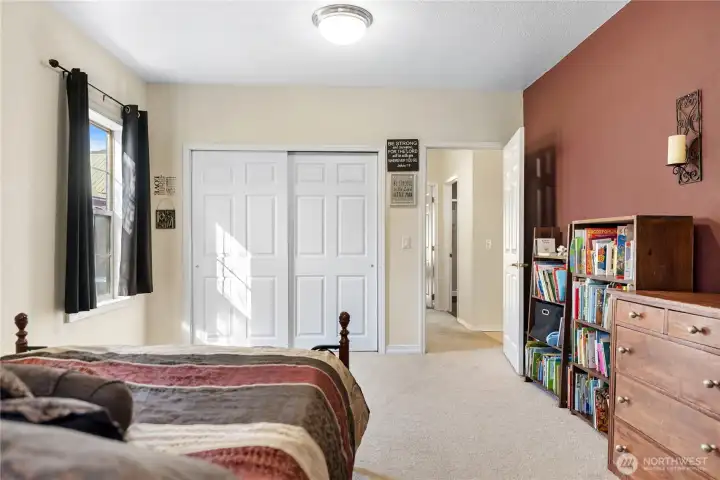 2nd bedroom, facing down the hall and Primary bedroom at the end, shared bathroom in the middle of the hallway
