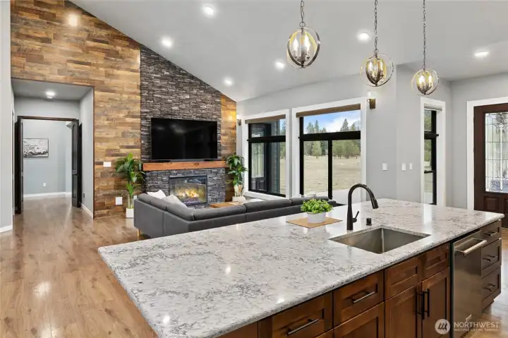 An entertainer’s dream, this expansive quartz island overlooks the dramatic great room with soaring ceilings, stone fireplace, and stunning mountain views. An entertainer’s dream, this expansive quartz island overlooks the dramatic great room with soaring ceilings, stone fireplace, and stunning mountain views.