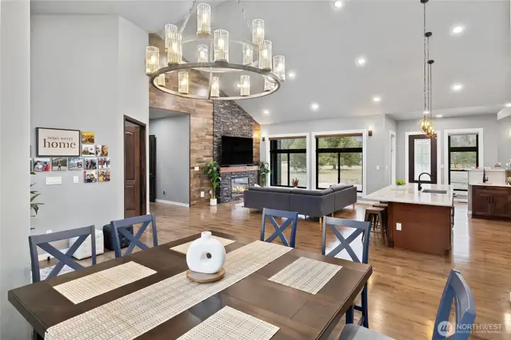 Open-concept design with soaring ceilings and expansive windows creates a light-filled gathering space. Open-concept design with soaring ceilings and expansive windows creates a light-filled gathering space.