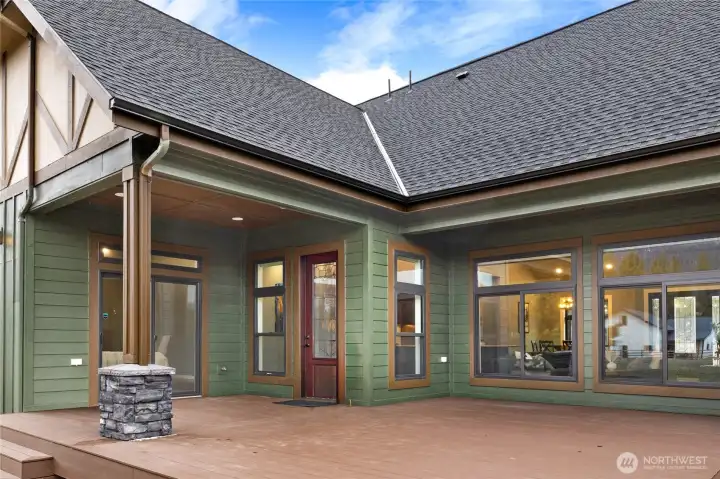 Designed for indoor-outdoor living with expansive covered patio space and panoramic mountain surroundings. Sliding Glass door heads to the media room and the beautiful wood door provides easy access to the kitchen. Designed for indoor-outdoor living with expansive covered patio space and panoramic mountain surroundings. Sliding Glass door heads to the media room and the beautiful wood door provides easy access to the kitchen.