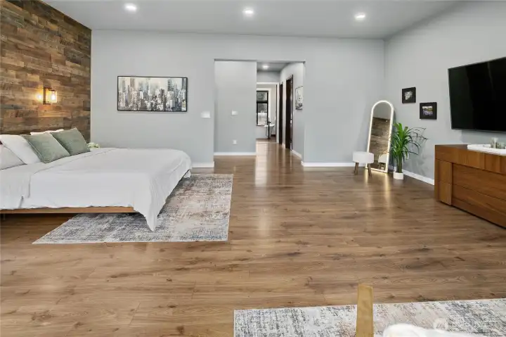 Expansive primary suite with seamless flow into the luxurious ensuite bath and walk-in shower. Expansive primary suite with seamless flow into the luxurious ensuite bath and walk-in shower.