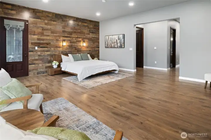 The spacious primary suite offers room to unwind with warm finishes, natural light, and a peaceful retreat-like atmosphere. The spacious primary suite offers room to unwind with warm finishes, natural light, and a peaceful retreat-like atmosphere.
