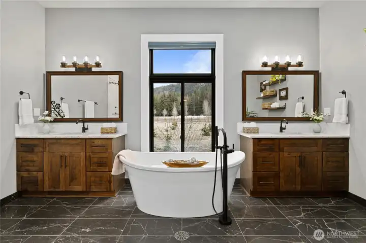 Spa-like soaking tub perfectly positioned beneath oversized windows creates a true retreat experience. Spa-like soaking tub perfectly positioned beneath oversized windows creates a true retreat experience.