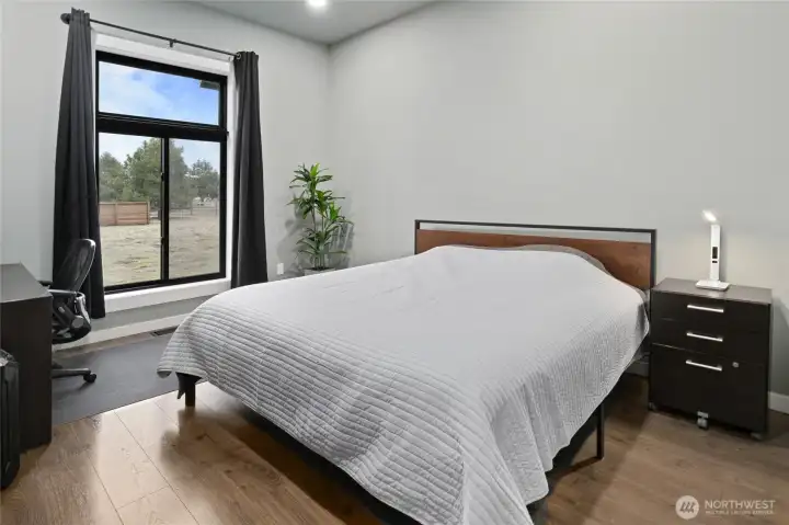 Bedroom number 2 with a large windows and clean modern finishes create a bright and welcoming atmosphere. Bedroom number 2 with a large windows and clean modern finishes create a bright and welcoming atmosphere.