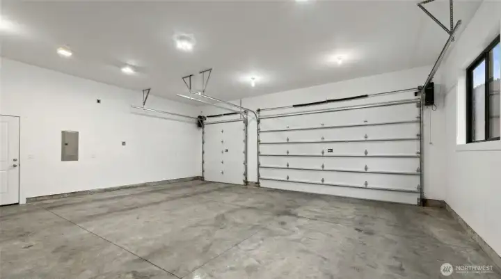 Oversized 3-car garage with room for vehicles, gear, toys, workshop space, and all-season recreation storage. Oversized 3-car garage with room for vehicles, gear, toys, workshop space, and all-season recreation storage.