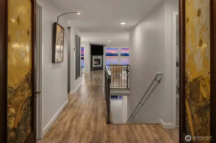 Perspective from the main entrance and cool custom double doors + staircase to the ground floor.