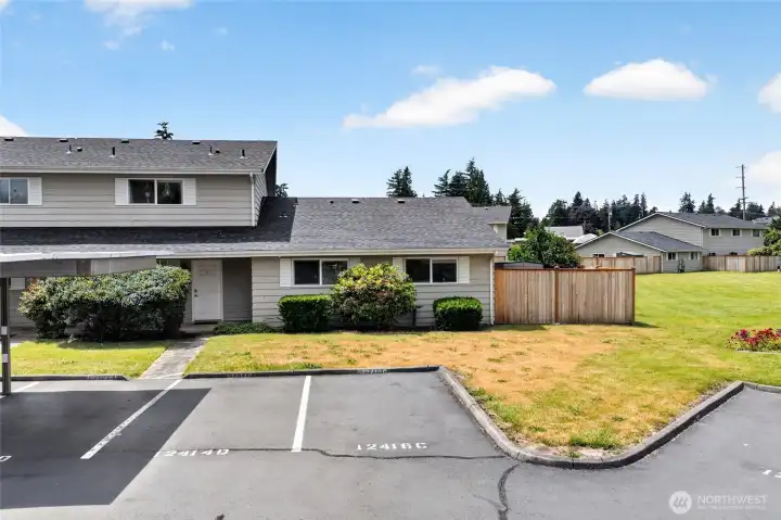 This single story townhome comes with two assigned parking spaces (one covered) immediately out your front door.