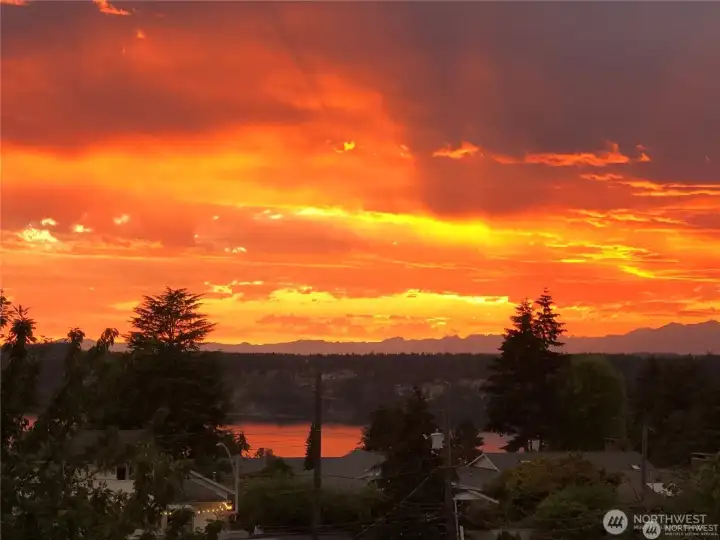 The rainy weather in the PNW can offer an assortment of colors each night. Some will only dream of such a view but this can be yours.