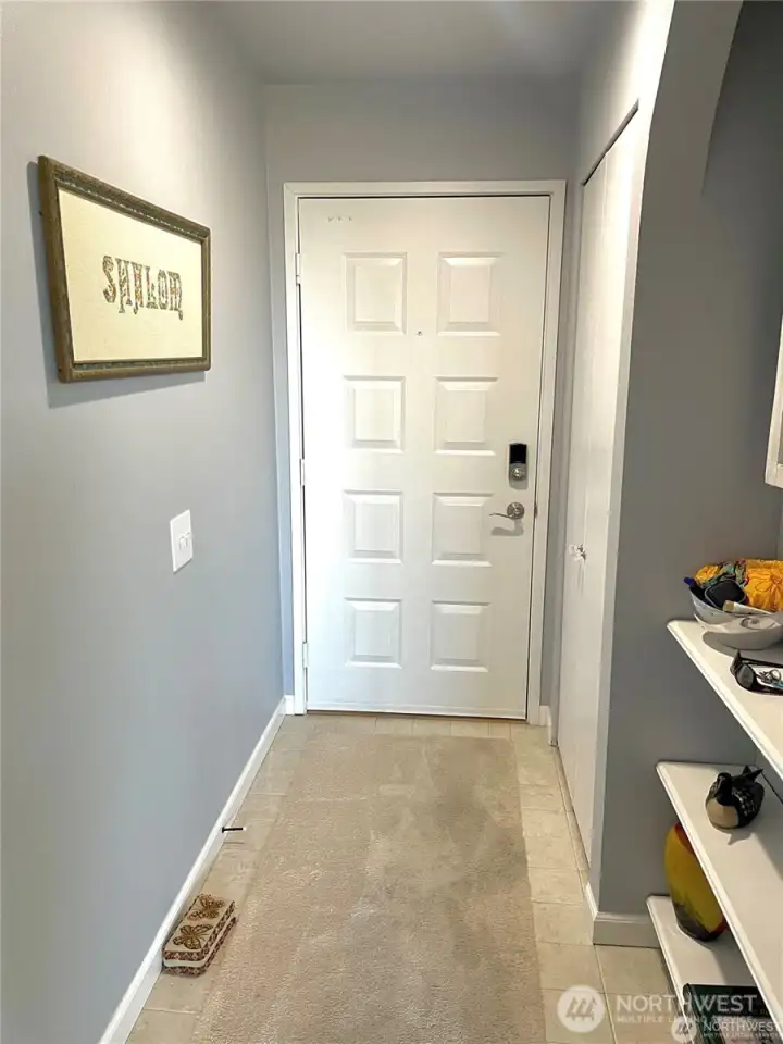 Welcome your guests in through this tasteful entry adapt with a large closet and shelves to leave your belongings and the day