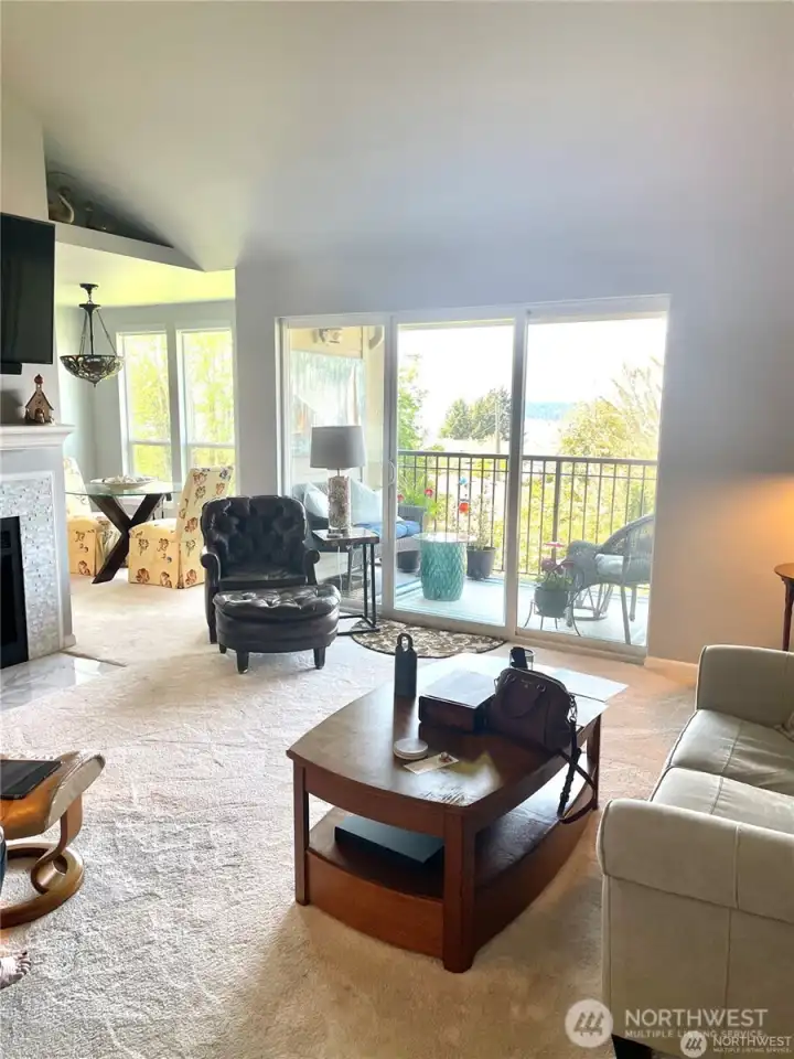 This view of the Livingroom shows the vast amount of natural light and views out to the water and mountains.