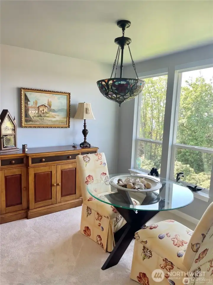 One view of the dining room which can hold a much larger table an from there you can enjoy the mountain and water views.