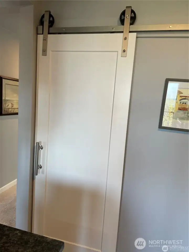 Off the kitchen is a laundry closet easily hidden from your day to day