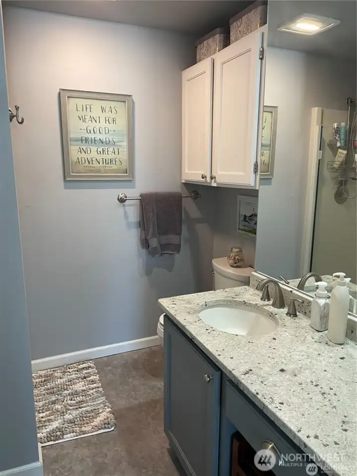 The master bedroom has its own bathroom with granite counters