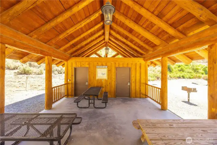 It provides shelter, facilities and spaces for gathering, eating and recreating.