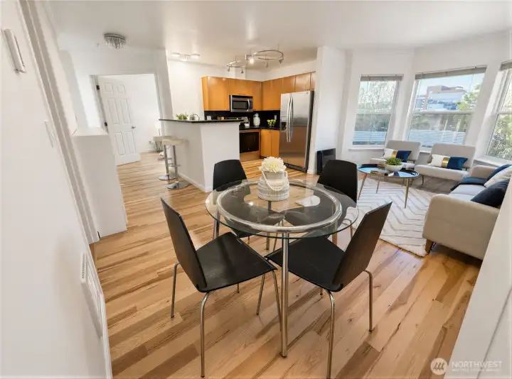Overall view of living room, dining room and kitchen.