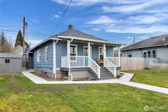 Angle view of front of home, new exterior paint and roof.  Tons of front lawn to work with