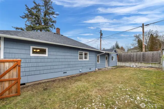 Level and usable fenced in side yard