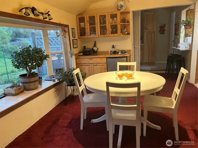 dinning room with with bar and small bar fridge
