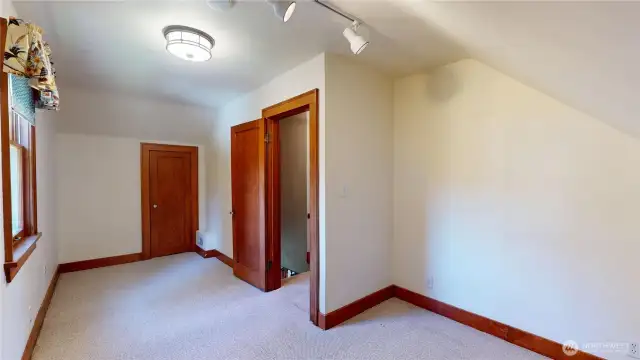 One of three bedrooms upstairs looking from doorway