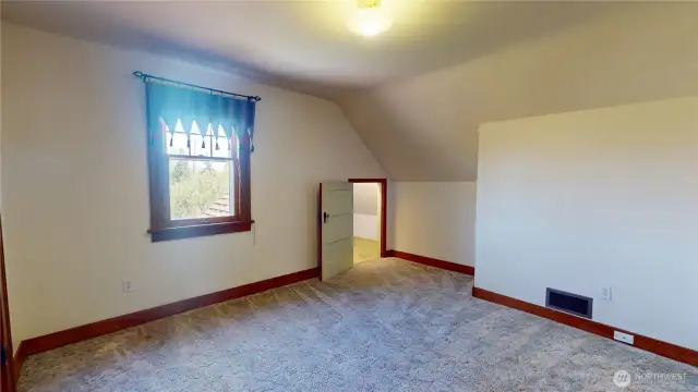 Second of three bedrooms upstairs looking from doorway