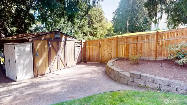 A large storage shed in the backyard can house all your yard tools