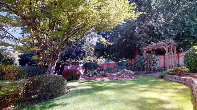A gate for access to the backyard lives behind the trellis