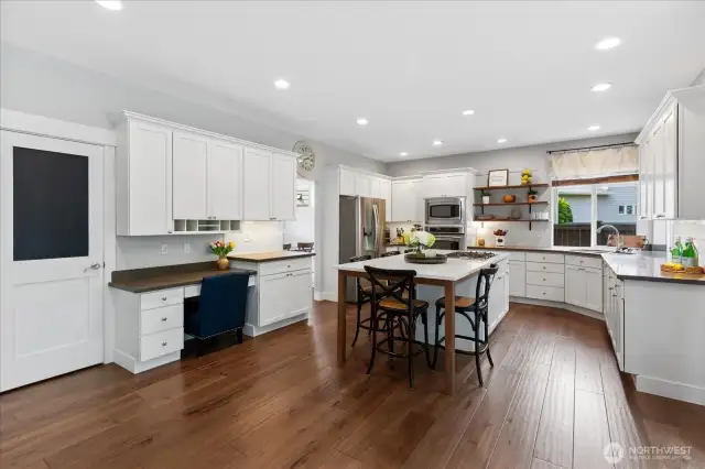 Big walk-in pantry tucked behind the chalkboard door. There's enough space in the kitchen for a 2nd table if you desire.