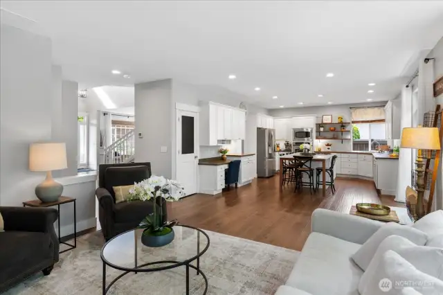 Agreeable Gray walls, 3 inch white millwork, loads of cabinets...and those gleaming engineered hardwoods.