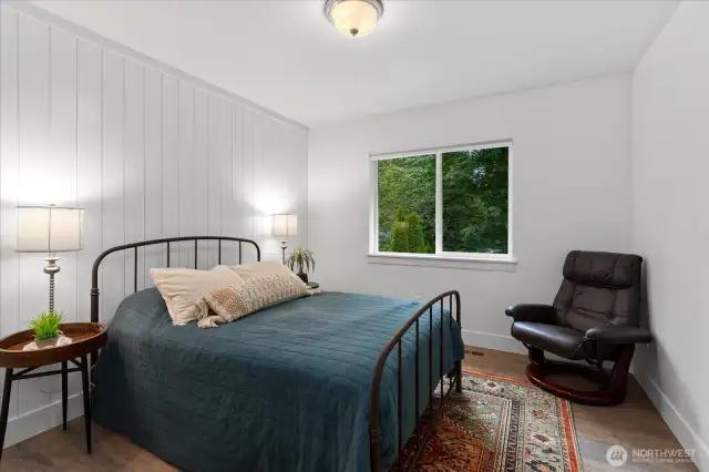 Bedroom #3 - faces East with LVP, custom closet, and ship lap.