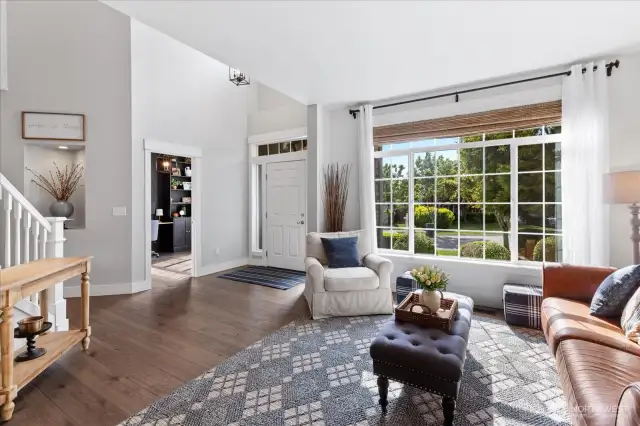A look back to the grand entry. Custom window treatments, wood wrapped windows, new entry light, engineered hardwoods, illuminated art niche. Extra Tall Baseboard. Lots of high end touches here.