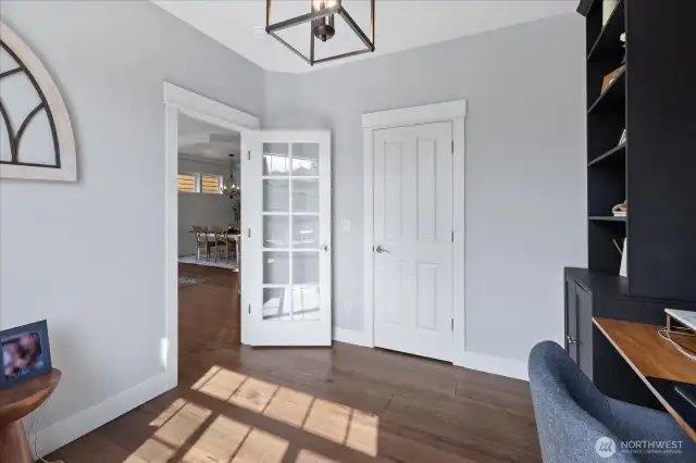 A look back at the closet and door on the main level bedroom. Add window treatment for quick privacy on the door.