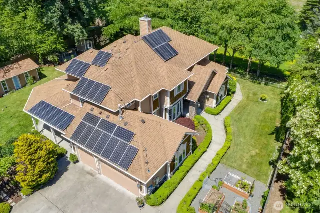 Here is a great shot of the recently cleaned roof, and the $30,000 Solar System the current owner invested for your future benefit!!  Low Electric bills! What a gorgeous view of the house and immediate surrounding yard.