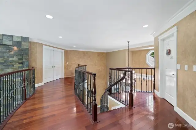 2nd floor landing, accentuated with the Iron Spindles and Brazilian Ironwood flooring!