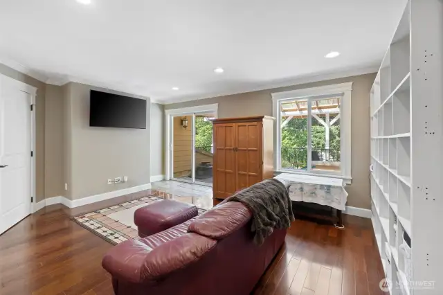 What a nice sized Bonus Room that you can do so much with! An expansive slate tiled deck through the doors outside! Movie room, game room, you name it!  Direct access to a half bath!